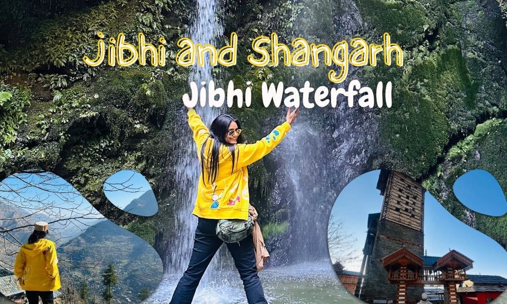 Woman in a yellow jacket facing a waterfall with arms raised at the jibhi waterfall spot